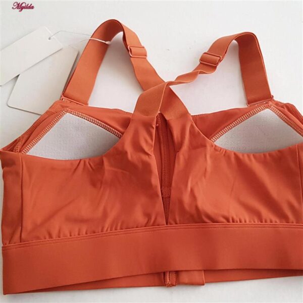 نیم تنه ورزشی زنانه ملییلدا مدل جلو زیپدار پد ثابت کد 5018 رنگ نارنجی