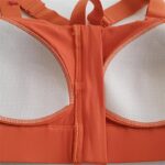 نیم تنه ورزشی زنانه ملییلدا مدل جلو زیپدار پد ثابت کد 5018 رنگ نارنجی