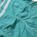 ست نیم تنه و شلوارک ورزشی زنانه ماییلدا مدل زیپ دار پشت چین دار کد 5243-8319 رنگ سبزآبی